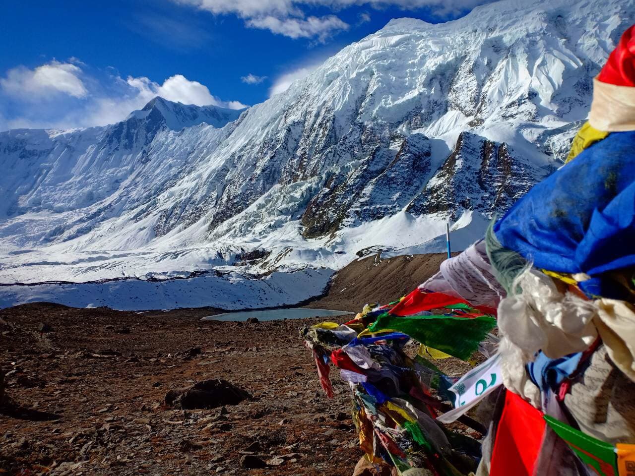 Prayer flags strung against a Himalayan peak